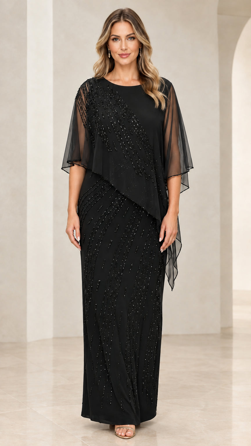 Front view of model wearing Black beaded capelet maxi dress
