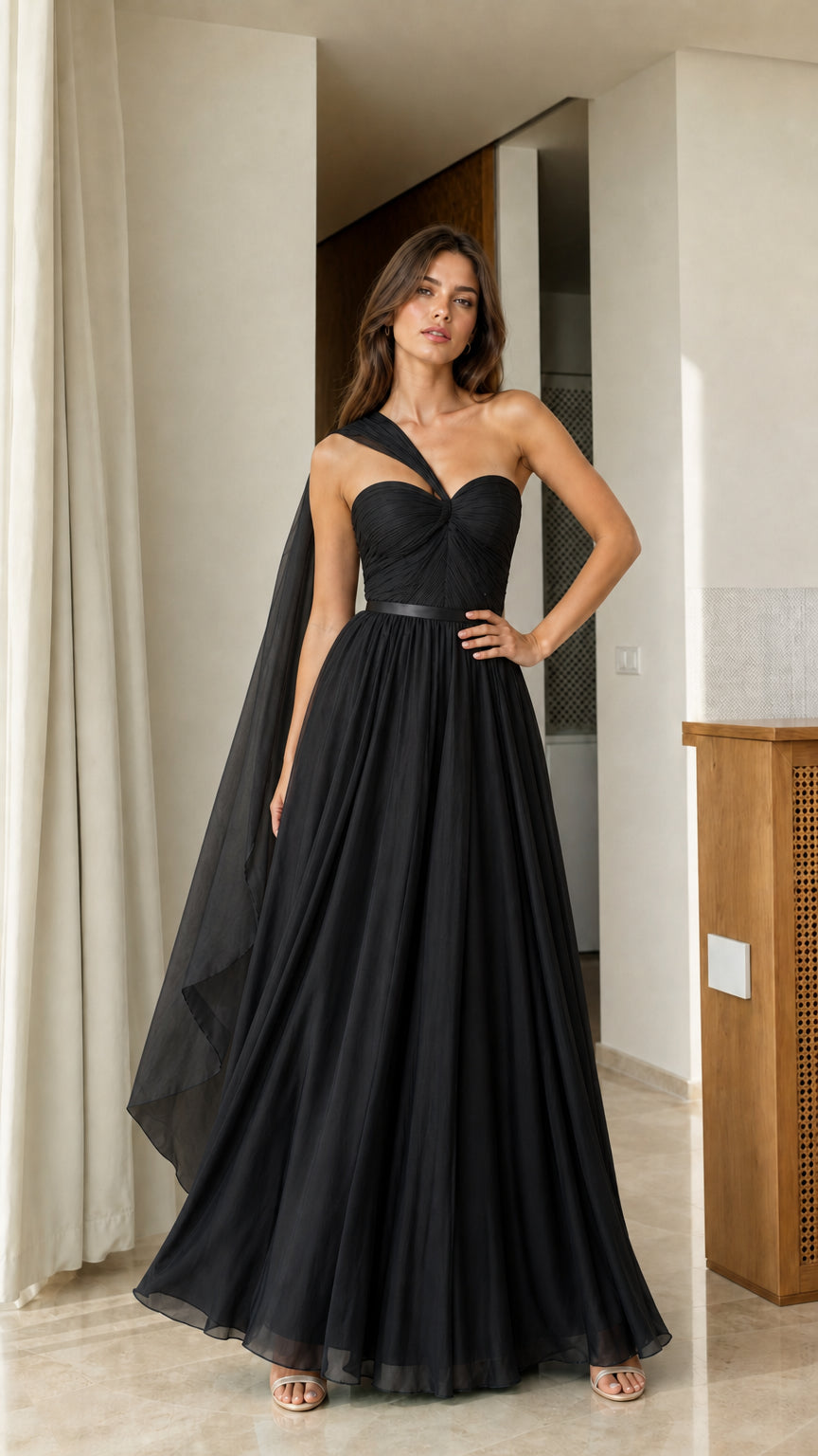 Full front view of solid black one-shoulder formal evening dress with cape sash