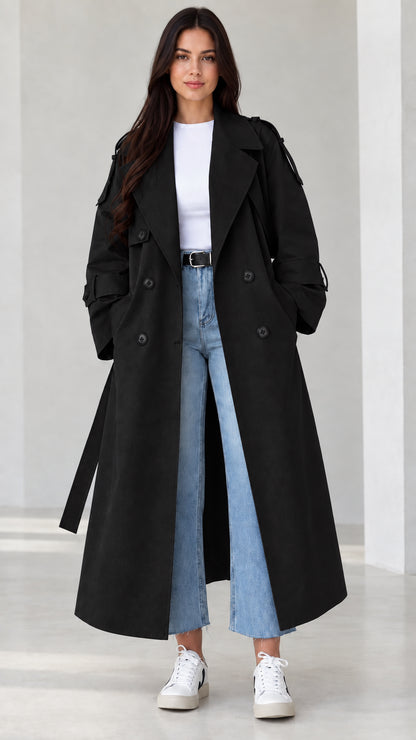 Front view of model wearing black double-breasted maxi trench coat