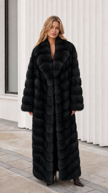 Front view of model wearing classic black full-length faux fur maxi coat