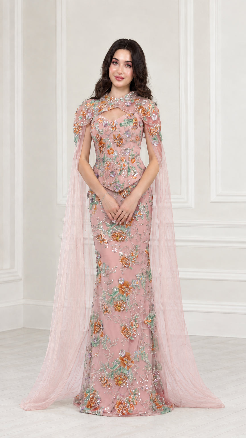 Front view of Blush Pink floral embroidered evening gown with sheer pink cape