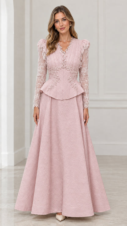 Front view of blush pink long sleeve lace peplum evening gown