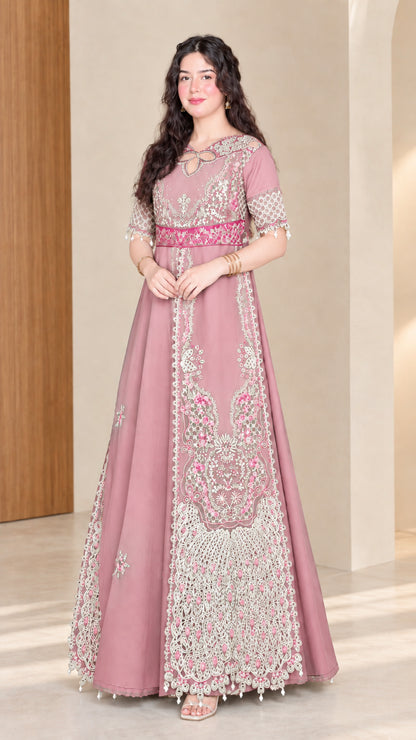 Front full view of woman wearing dusty pink embroidered maxi dress