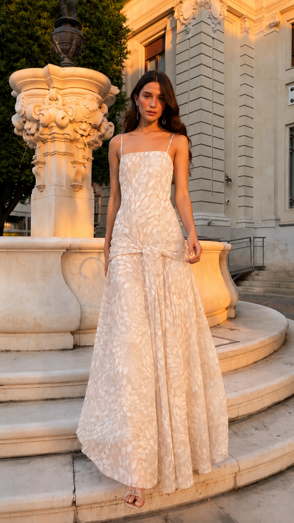 Front view of cream printed square neck spaghetti strap maxi dress