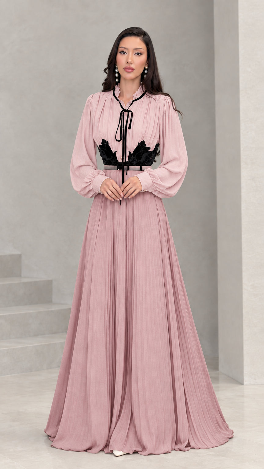 Full front view of dusty pink and black long sleeve pleated maxi dress