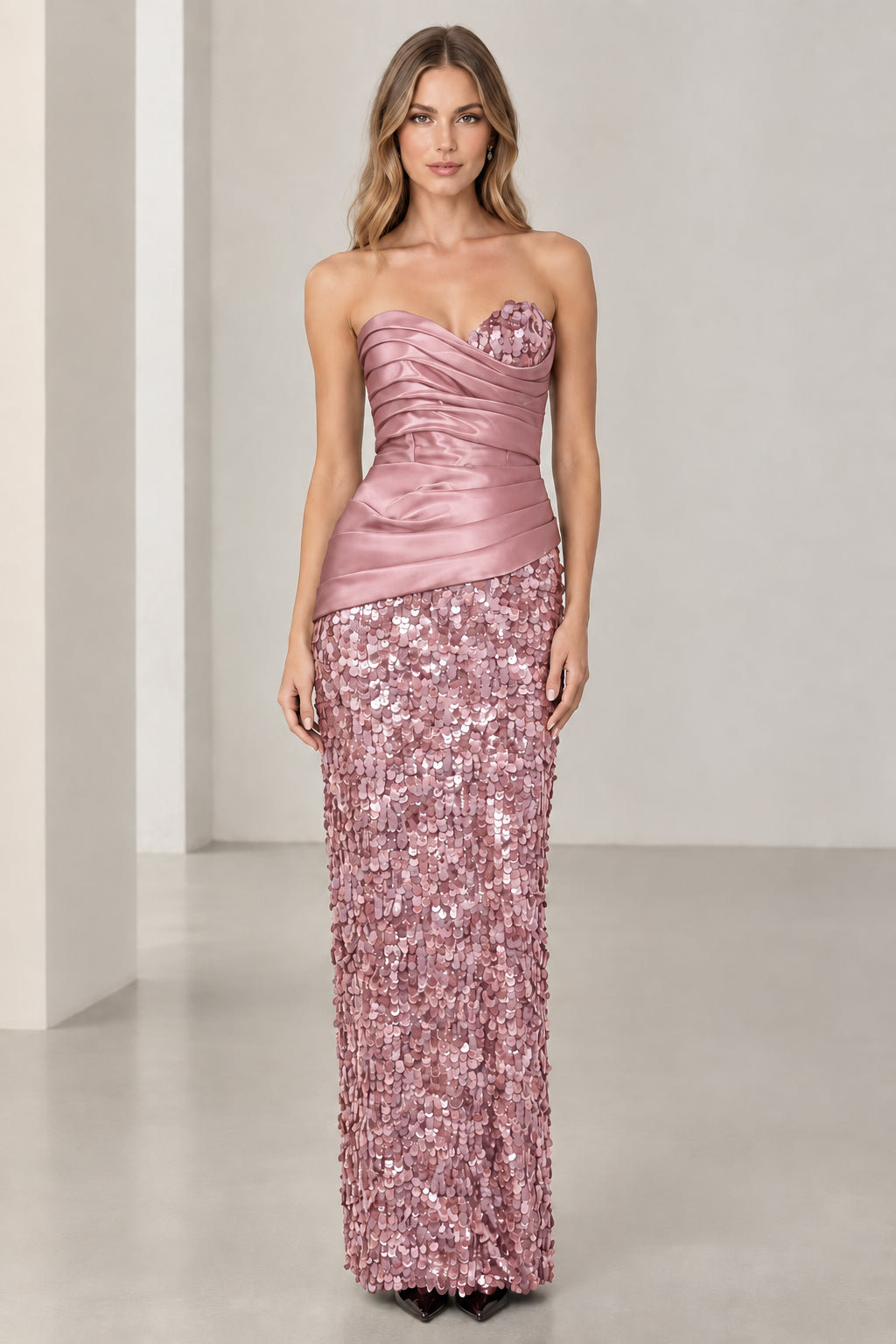 Model wearing blush pink strapless satin corset sequin maxi gown