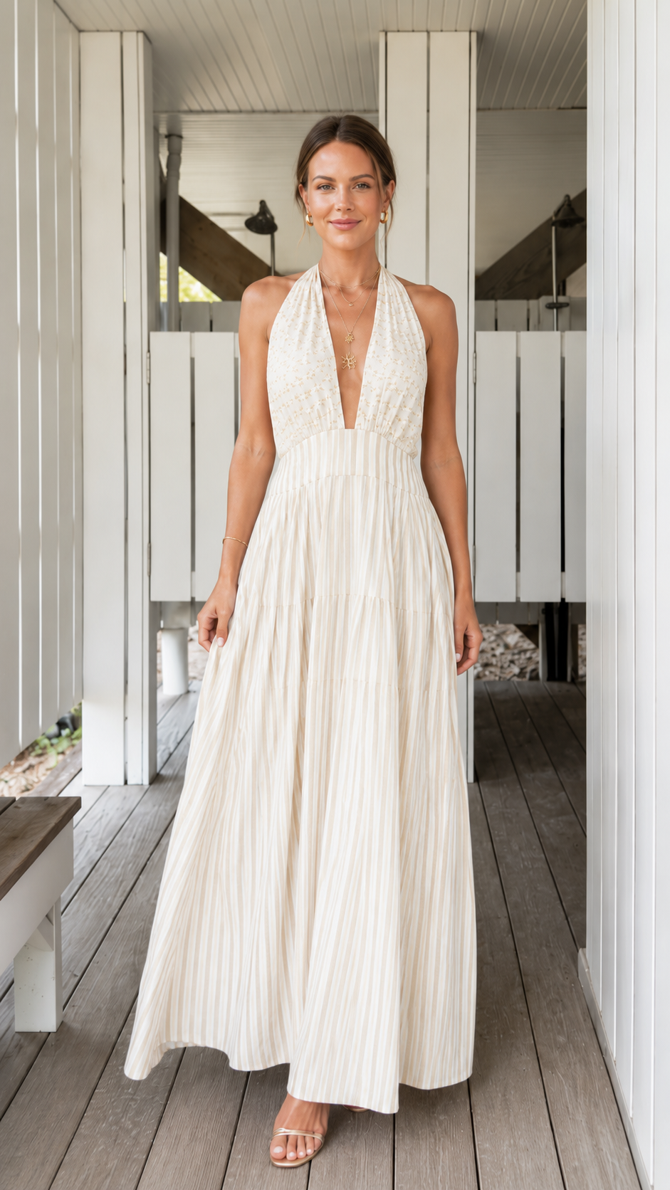 Front view of ivory pleated halter backless maxi dress