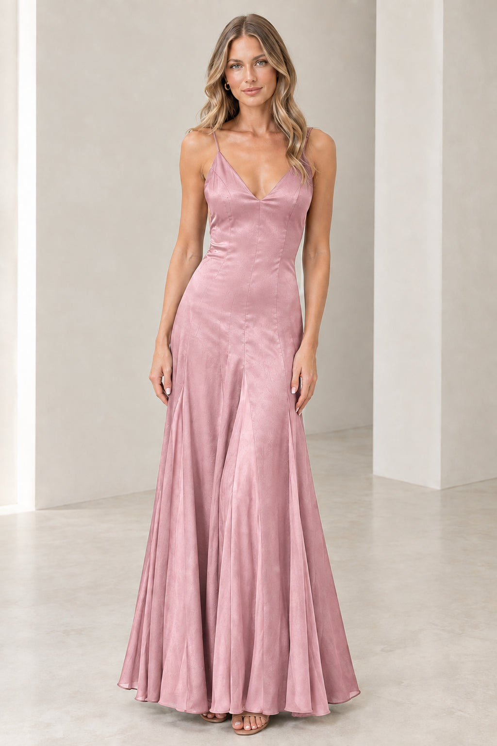 Front view of model wearing Dusty Pink satin spaghetti strap maxi gown
