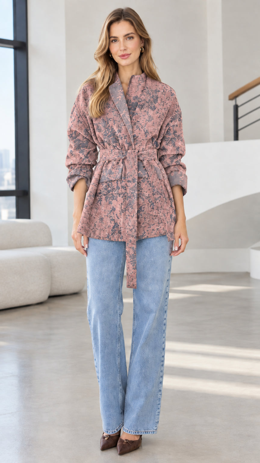 Model wearing dusty rose pink floral jacquard belted wrap jacket