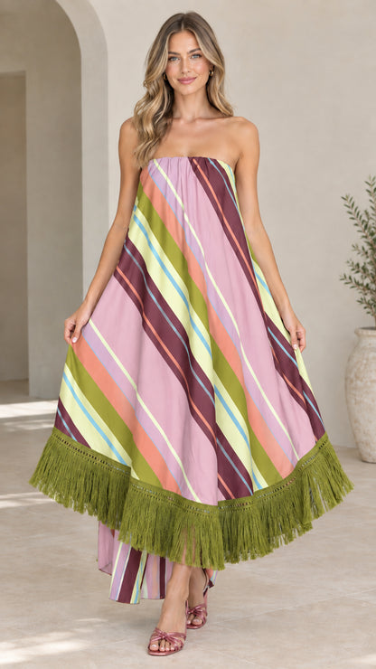 Front view of woman wearing lilac pink striped strapless maxi dress with olive green fringe
