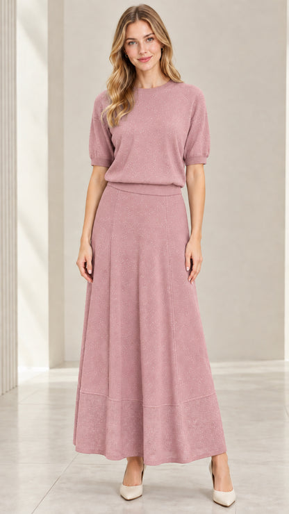 Model wearing dusty rose pink sparkle knit top and A-line maxi skirt set