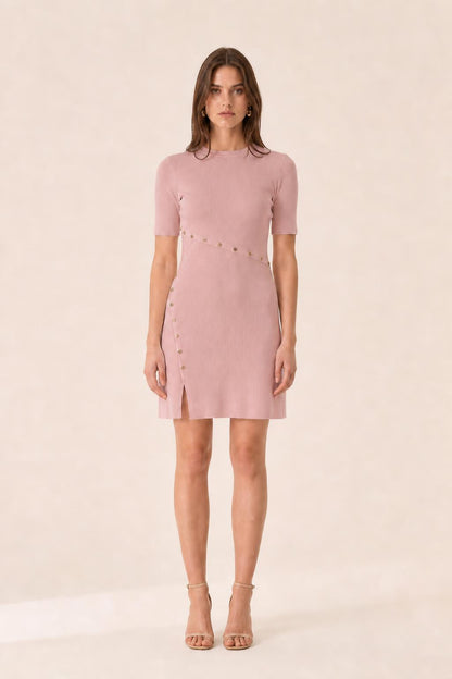 Front view of woman wearing pink ribbed knit mini dress