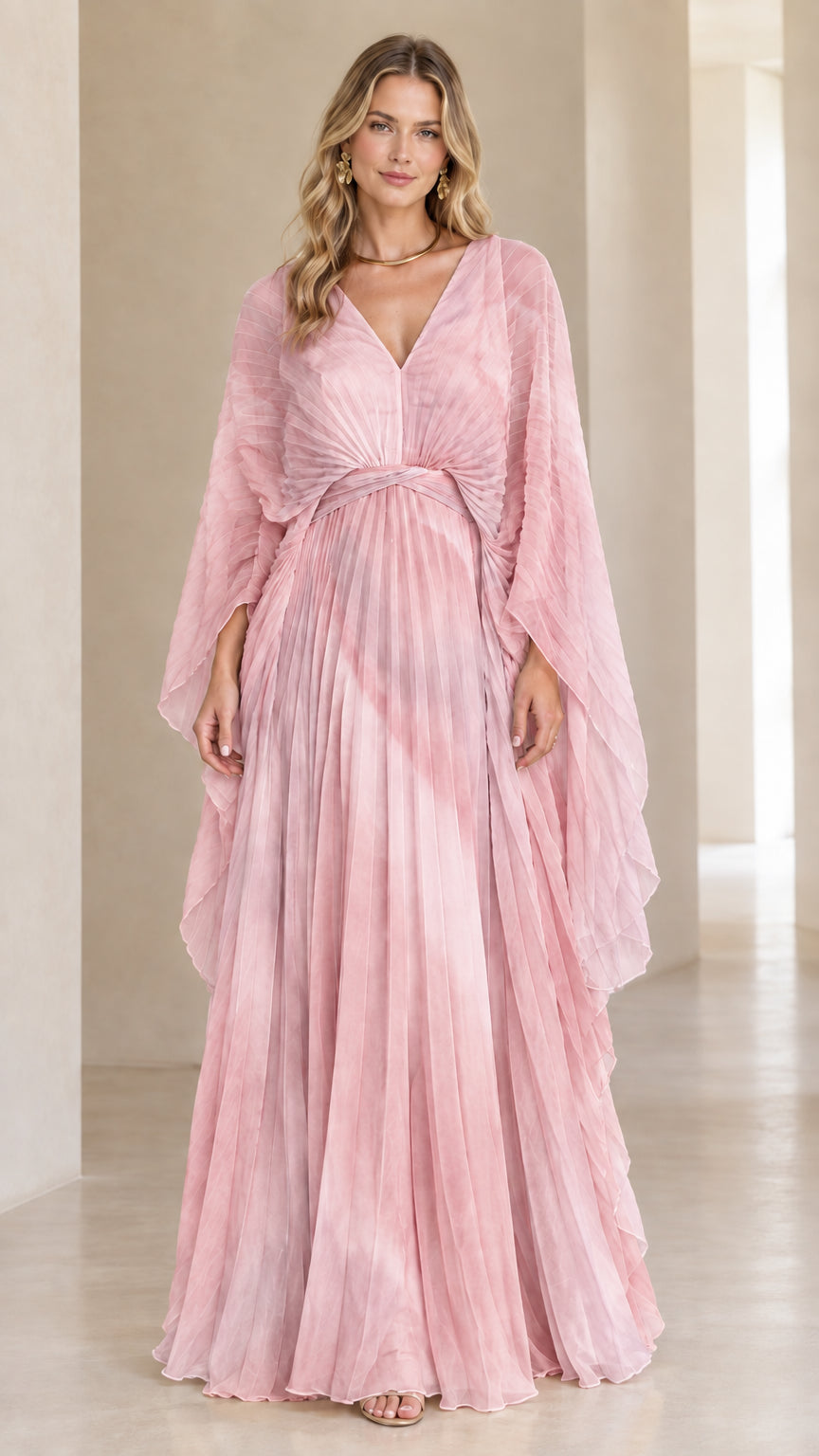 Front view of model wearing blush pink pleated cape sleeve formal maxi dress