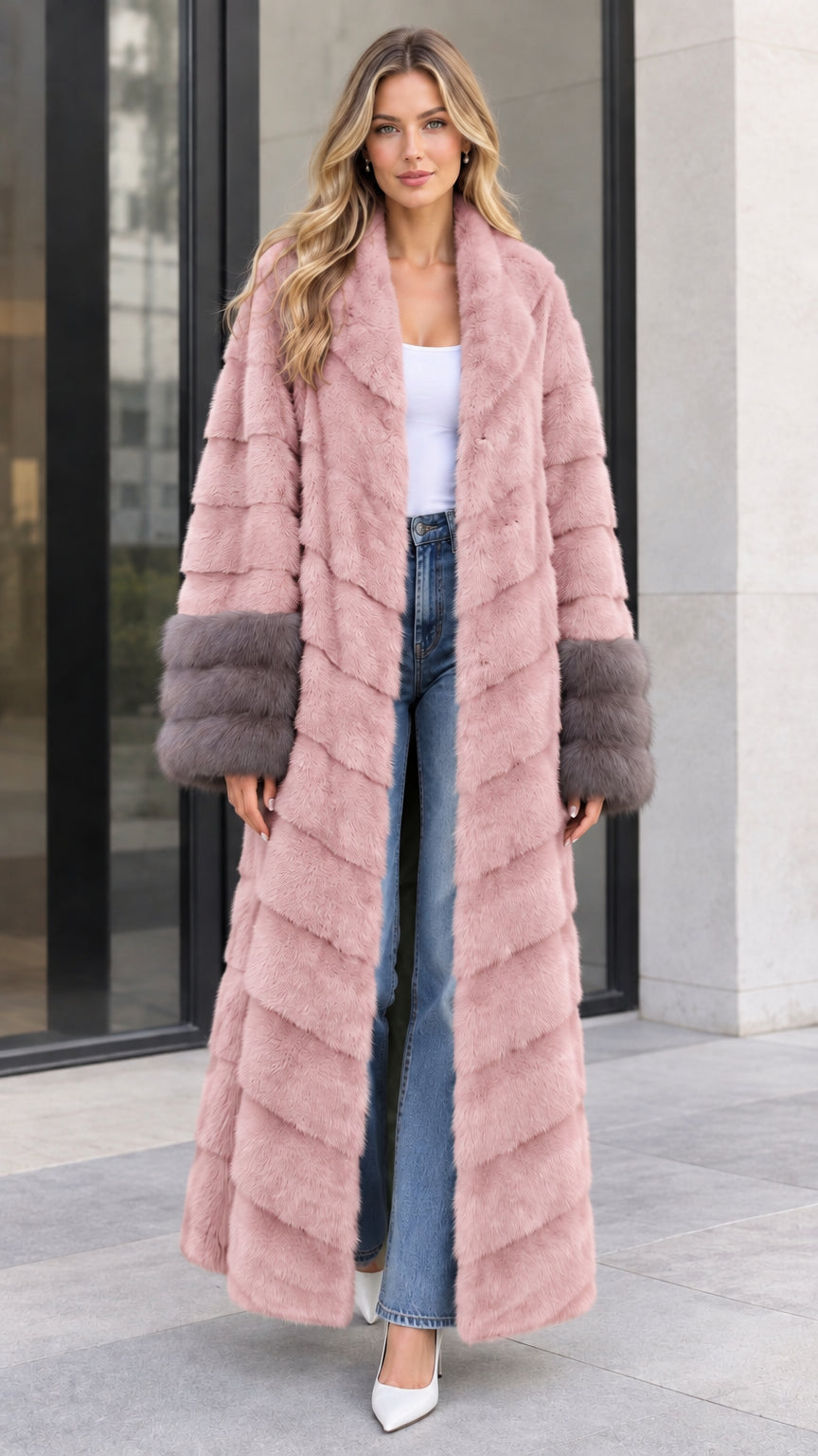 Front view of women's dusty pink chevron maxi faux fur coat with contrast grey cuffs