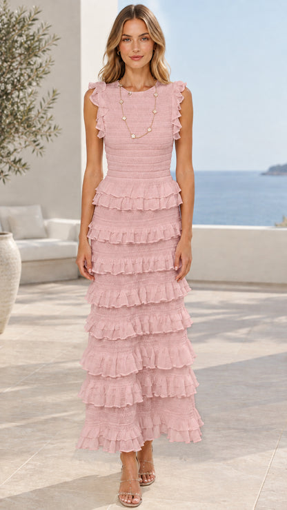 Model wearing blush pink sleeveless tiered ruffle maxi dress