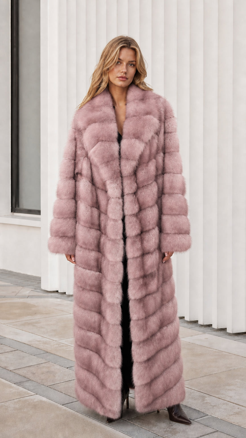 Front view of model wearing dusty rose pink full-length faux fur maxi coat