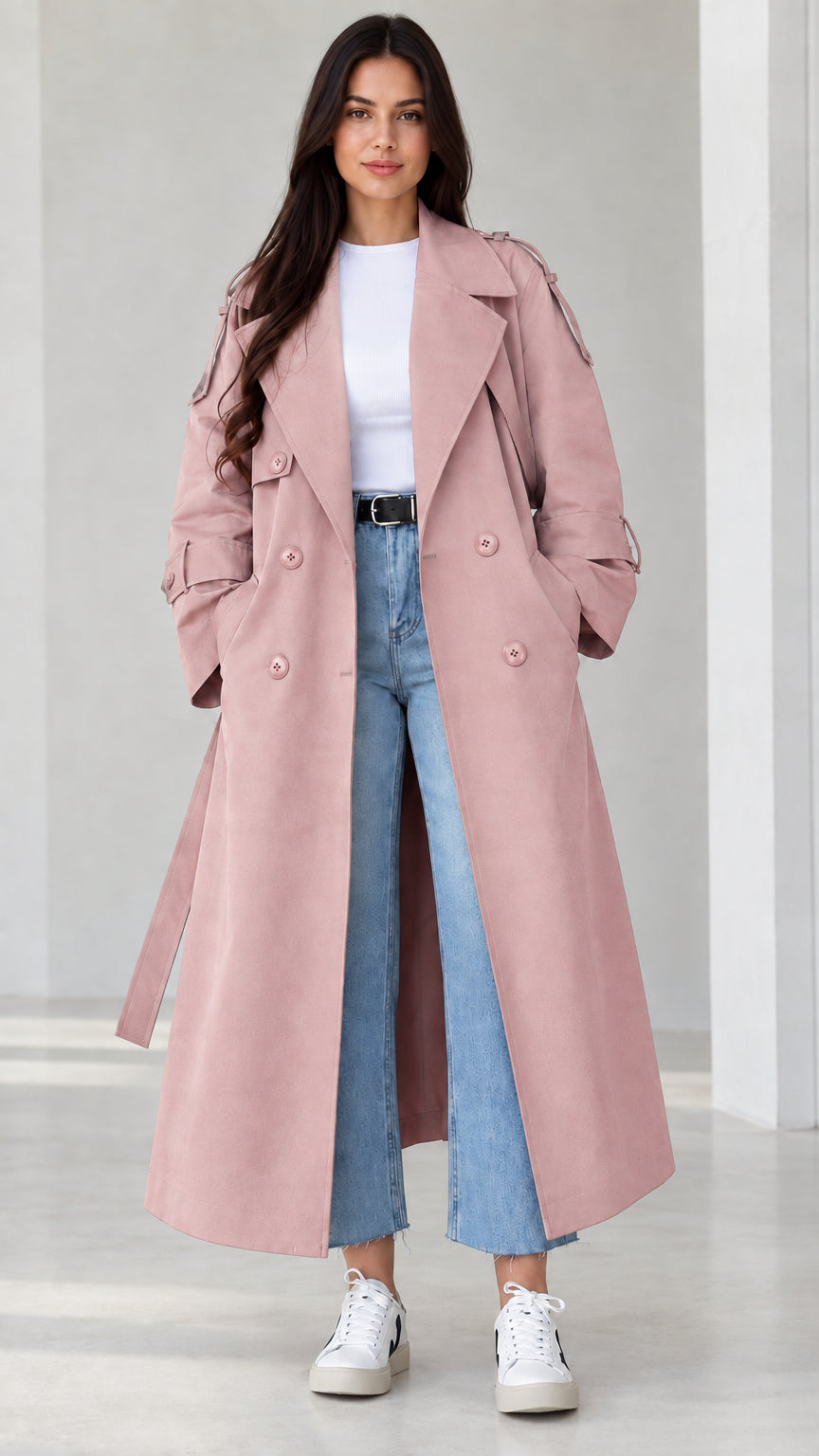 Front view of model wearing dusty pink longline belted trench coat