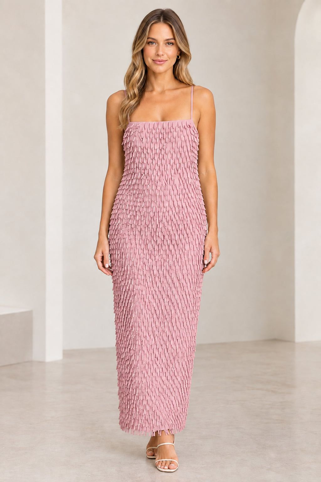 Front view of woman wearing Dusty Pink textured fringe spaghetti strap maxi dress