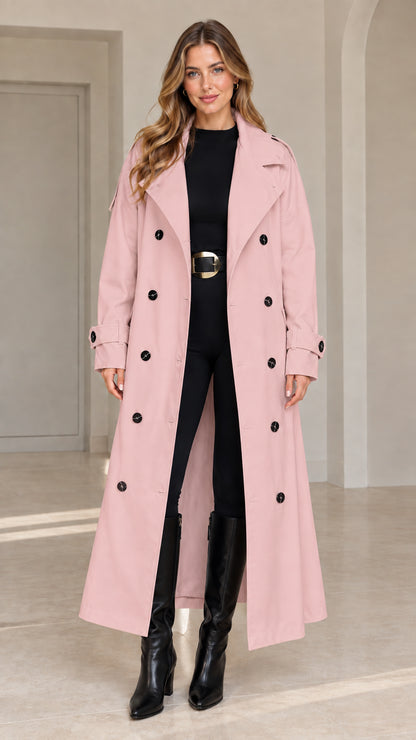 Front view of woman wearing dusty pink longline belted trench coat