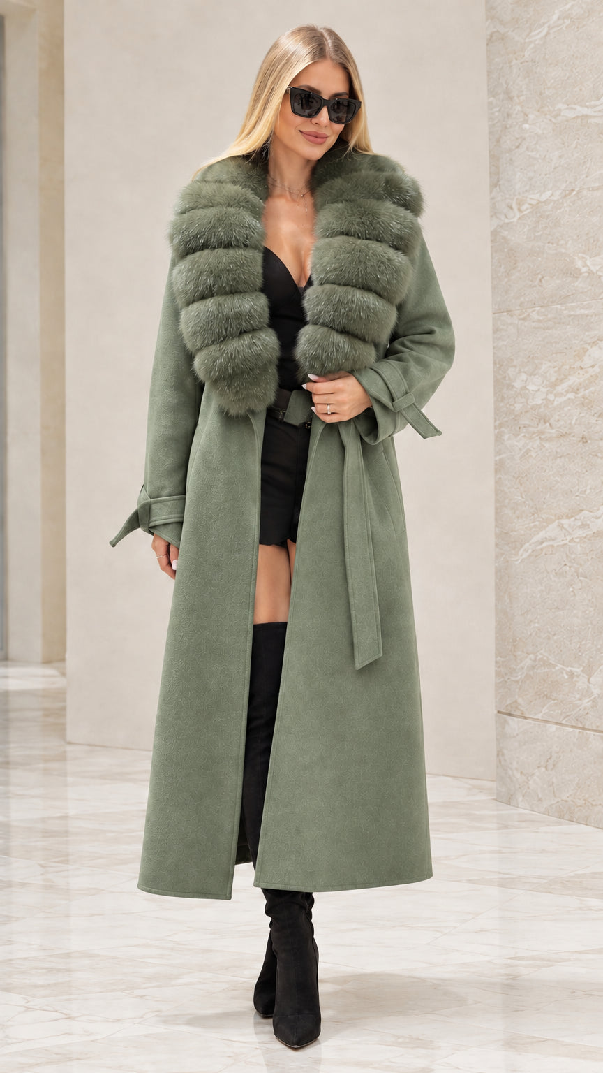 Front full view of woman wearing sage green longline trench coat with faux fur collar
