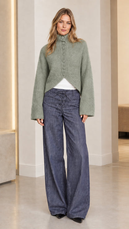 Women's sage green high neck knit sweater paired with wide leg denim pants