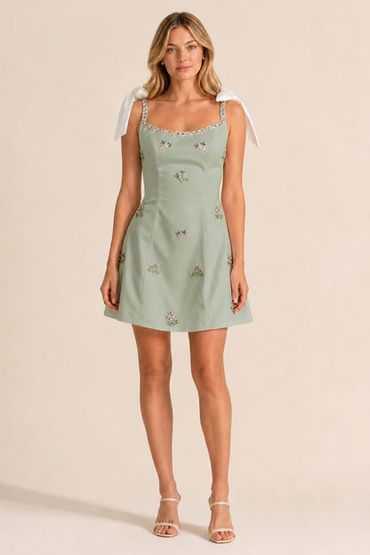 Front view of sage embellished mini dress