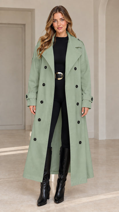 Front view of woman wearing sage green maxi belted trench coat
