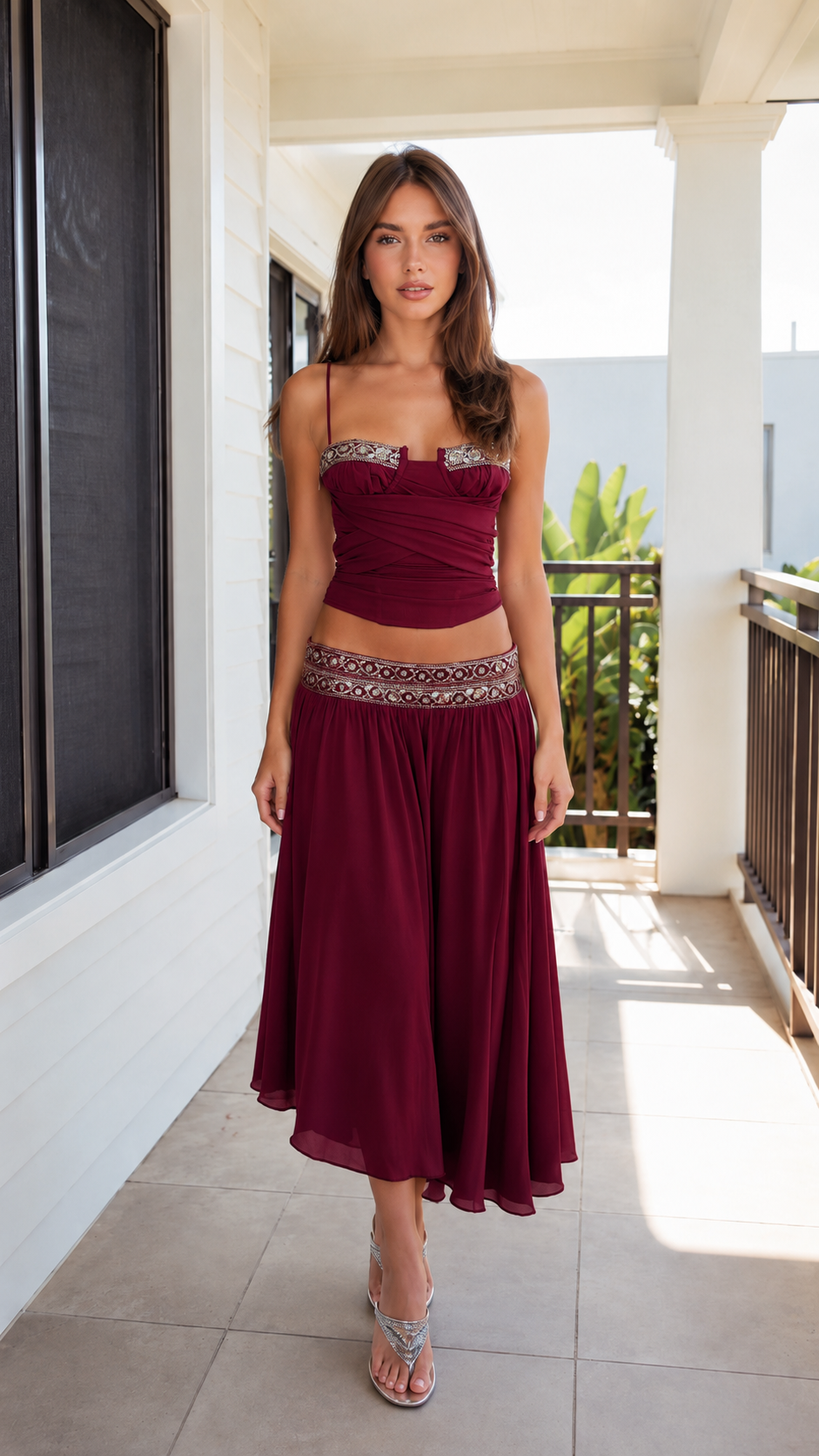 Front view of burgundy ruched cami top and flowing midi skirt set