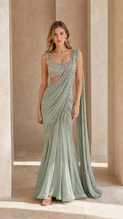 Front full view of sage green embellished pre-draped saree evening gown