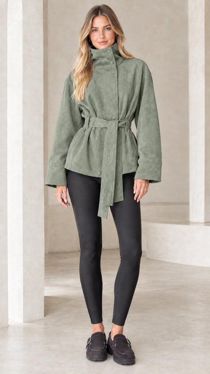 Model wearing sage green high-neck belted faux suede jacket