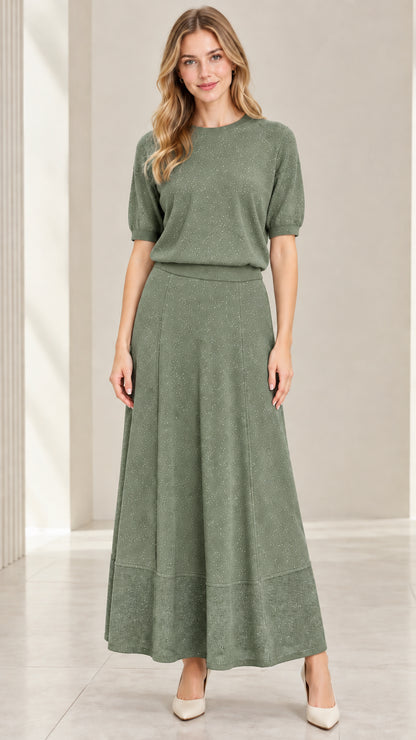 Model wearing sage green short sleeve shimmer knit top and maxi skirt set