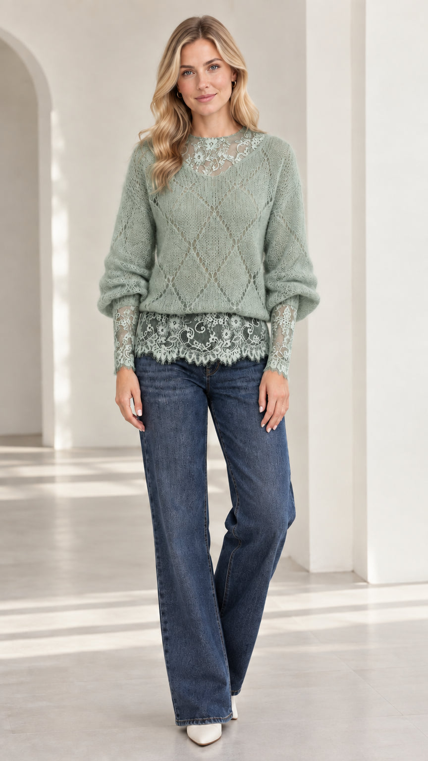 Model wearing sage green diamond knit pullover with delicate lace accents