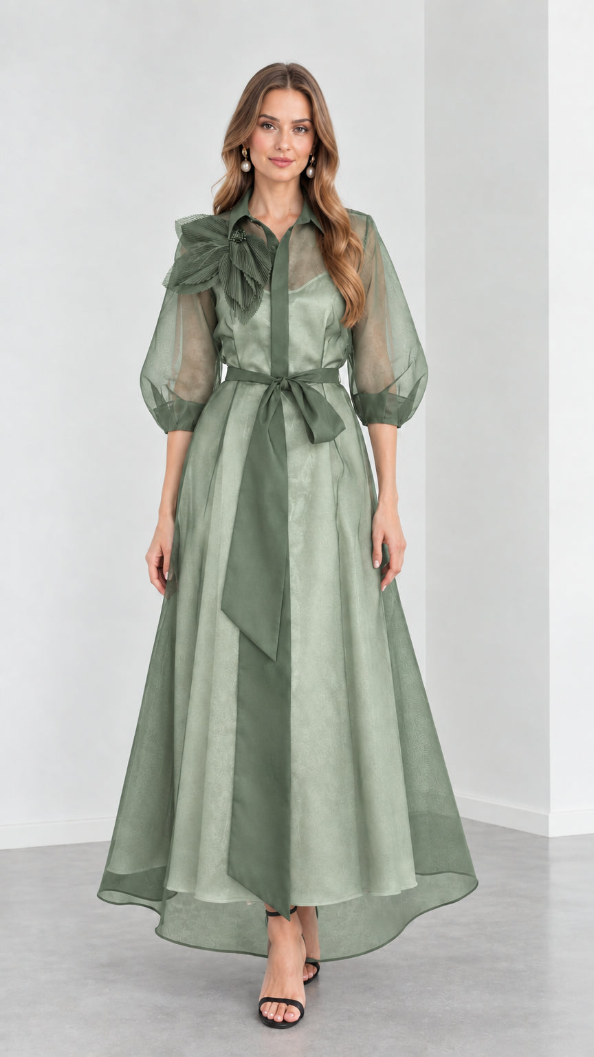 Front view of model wearing monochromatic Sage Green organza collared maxi gown with tie sash