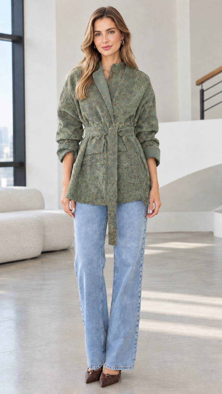Model wearing sage green floral jacquard belted wrap jacket