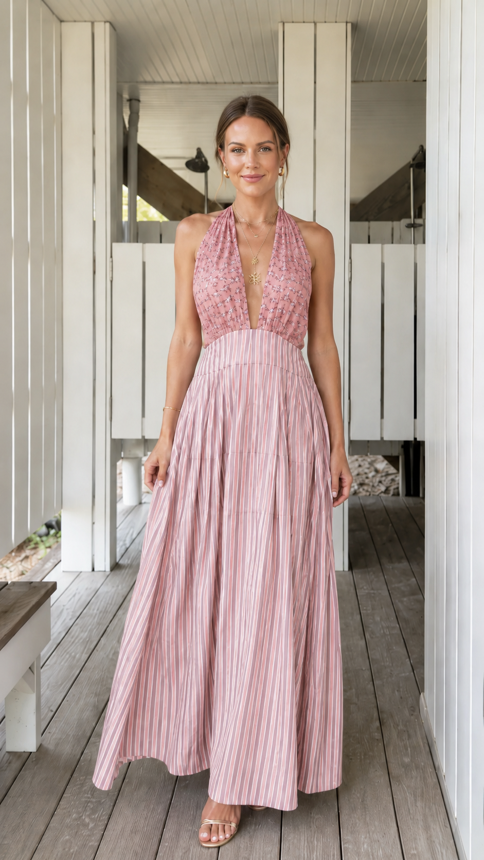 Front view of blush pink pleated halter backless maxi dress