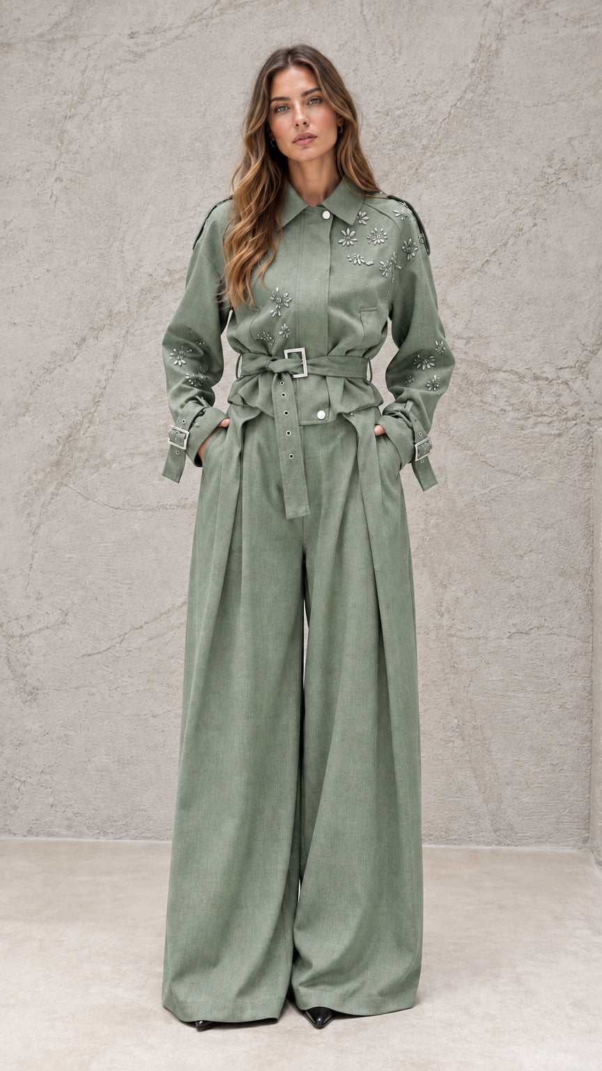 Full front view of model wearing sage green embellished wide-leg jumpsuit