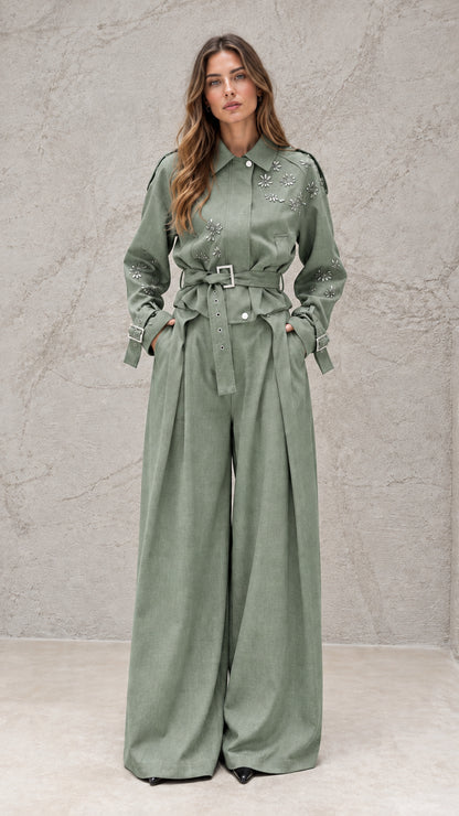 Full front view of model wearing sage green embellished wide-leg jumpsuit