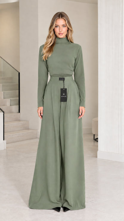 Front view of model wearing sage green mock neck top and high-waisted wide-leg pants set
