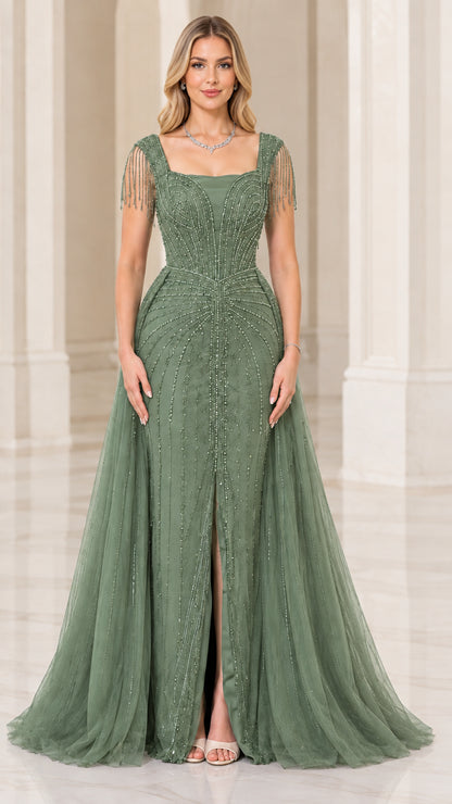 Full-length front view of sage green beaded evening gown with front slit and overskirt