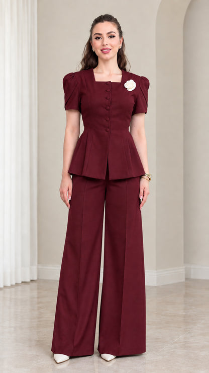Model wearing Burgundy tailored peplum suit set with wide leg trousers