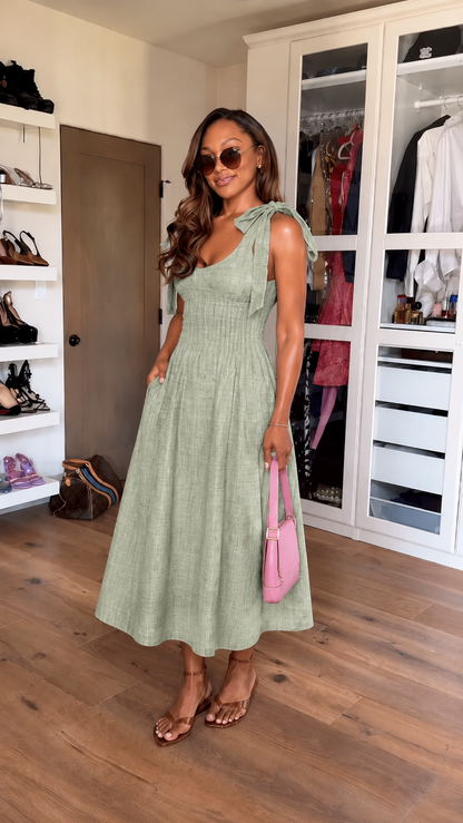 Front view of sage green tie-shoulder smocked midi dress with pockets