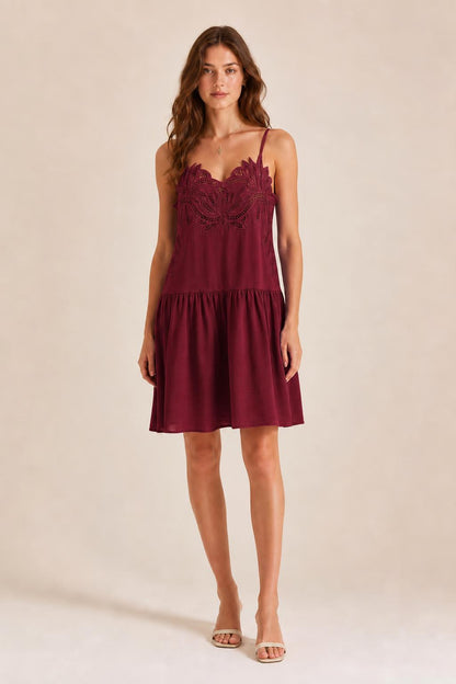 Front view of model in Burgundy embroidered cami mini dress