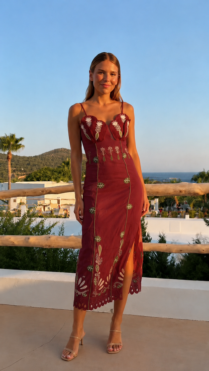 Front view of wine embroidered bustier midi dress with side slit