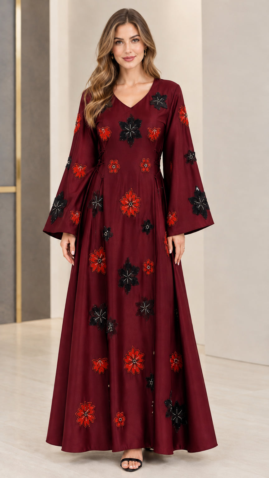 Front view of burgundy red floral embroidered maxi gown with flared sleeves