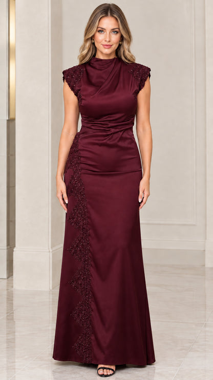 Front view of woman wearing burgundy wine satin evening gown with beaded embroidery