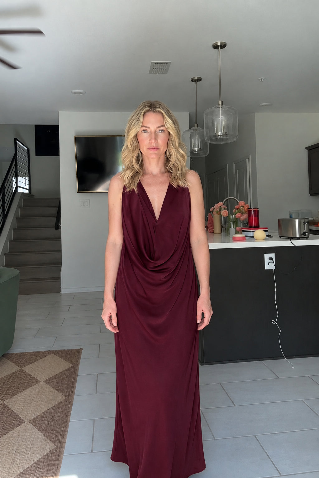 Front view of woman wearing Burgundy wine draped cowl neck maxi dress