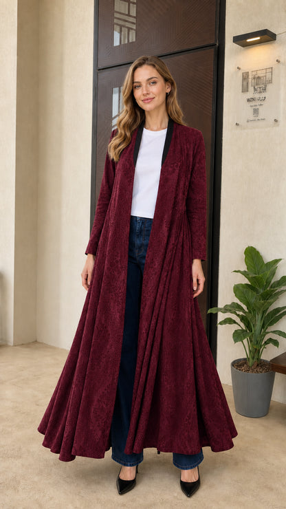 Front full-length view of burgundy wine red pleated flowing maxi duster coat