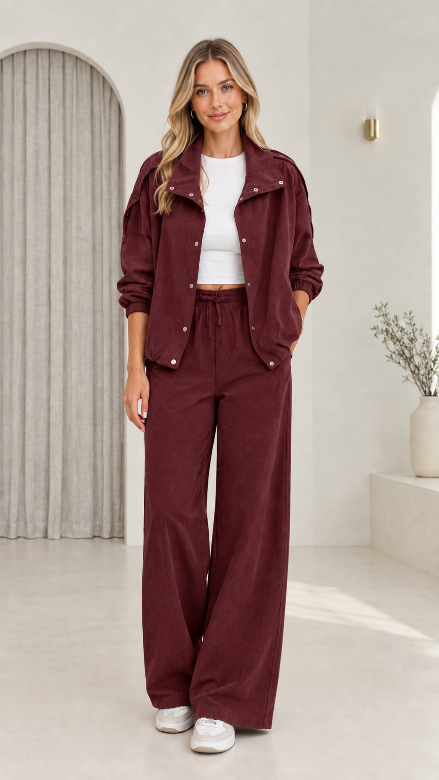 Front view of model wearing burgundy matching utility pant set