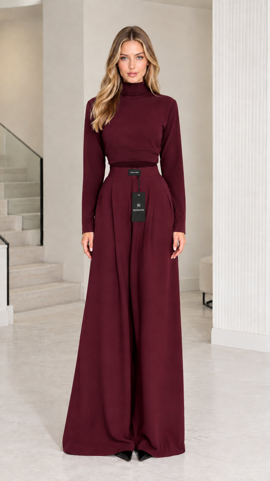 Front view of model wearing burgundy wine mock neck top and wide-leg trousers set