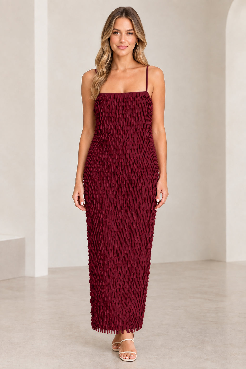 Front view of woman wearing Burgundy wine textured fringe spaghetti strap maxi dress